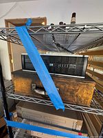 Front view of HP desktop resting on aged wooden box