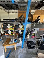 Overall shelf with LED boxes, racquets, skimmer, fan, remote and other items