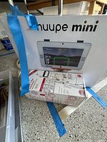 Boxed Huupe Mini hoop system alongside boxed sprayer