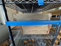 Two sealed Katorn boxes on shelf, labels visible