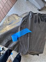 closed black garbage bag containing toys