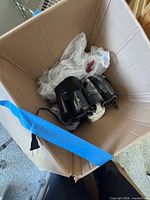 Box containing Chefman air fryer and stainless steel carafe