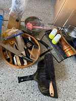 Full view of mixed kitchen items on floor