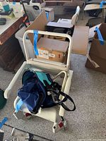 Rolling shower-commode chair with bag placed on seat