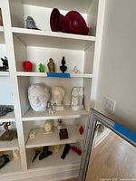 Full view of shelving with assortment of 3D printed pieces