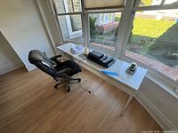 Desk, chair, printer, lamp and small items in situ