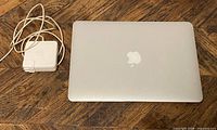 Closed MacBook Air with power adapter