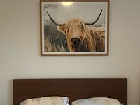 Artwork above headboard showing scale