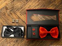 overview of both bow tie and cufflink sets in boxes