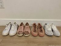 All four pairs of sneakers lined side by side