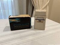 Pana-Vue II slide viewer beside its original box