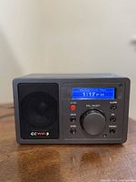 Front view showing display, controls and speaker grille