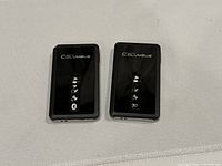 Front view of both Columbus V-990 devices showing indicator icons and branding