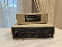 Front view of both units showing Radio Direction Finder controls and tuning scale, and Low-Pass Filter specification plate