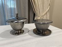 Both lidded bowls side by side