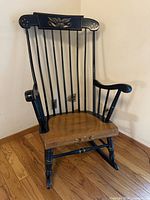 Full front view of rocking chair showing frame and seat