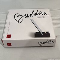 Closed boxed set front showing Buddha Board branding
