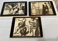 All three Picasso placemats showing designs and gold borders