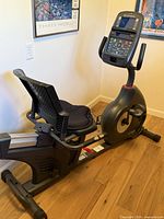 Full side view of Schwinn recumbent bike showing frame, seat, pedals and console