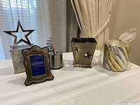 Group shot of all six silver and gold-tone décor items