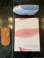 Braun ThermoScan thermometer, boxed electric manicure kit, closed leather pouch
