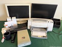 Overall lot showing monitors, printer, PD drive, accessory boxes, organizer and cables