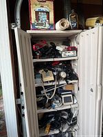 Full view of open cabinet showing shelves and contents