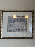 Full view of one framed print showing frame style and image