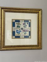 Full view of framed botanical print on wall