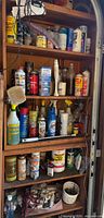 Full view of cabinet with shelves of vintage chemicals