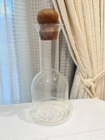Full view of Dansk glass carafe with teak stopper inserted