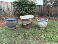 Three planters on lawn showing size, colors, damage