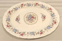 Full view of oval platter showing floral border and center design