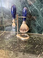 Full view of shaving set showing razor, brush and stand