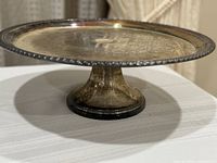 Full view of round silver pedestal cake stand