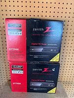 Front view of two Zenith DTT900 series converter box retail cartons