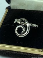 Ring in box showing spiral design from top