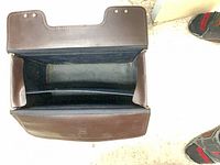 Top view of open briefcase showing lined interior and divider