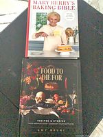 Both hardcover cookbooks front covers visible