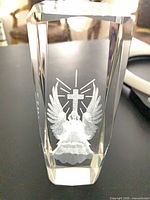 Front view showing full angel and cross engraving in crystal block