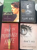 All four book fronts displayed