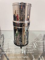 Full view of assembled stainless Berkey filtration unit with spigot