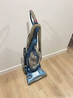 Front view of blue Bissell Healthy Home upright vacuum