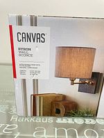 Front of one box showing brand, model, finish and shade information