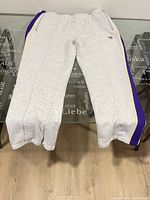 Full view of jogging pants front side on table