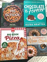 Front covers of all four cookbooks