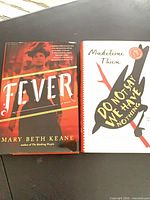 Front covers of both hardcovers