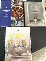 All three cookbooks displayed cover up on tabletop