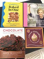 Group shot of all four cookbooks showing fronts