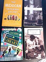 All four books front covers visible